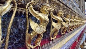 Golden Statues on the Wall of the Pagoda, Thailand